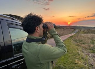 Featured Bird Watcher: Klay Blake Klay Blake bird watching at sunset on the Isle of Mull