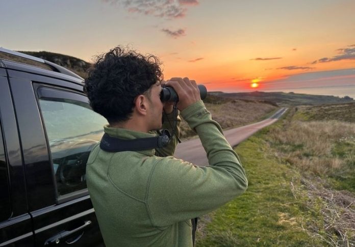 Klay Blake bird watching at sunset on the Isle of Mull