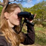 woman-looking-through-binoculars